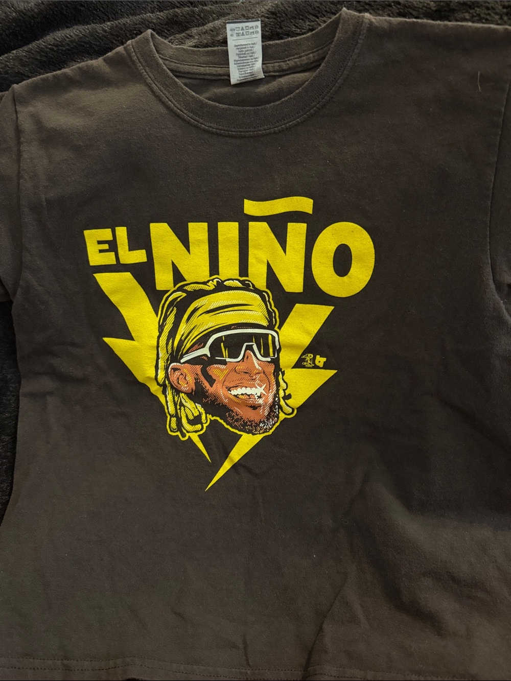 Source Unknown Black Tee with Yellow "El Niño" Graphic